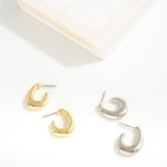 Sleek Curl Huggie Hoops